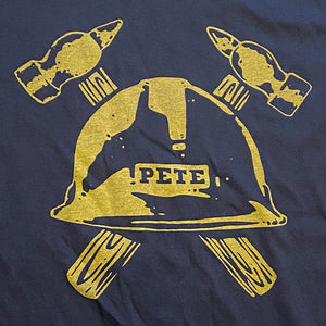 Gold and Black Pete's helmet shirt closeup